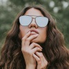 Girl looking up wearing sunglasses
